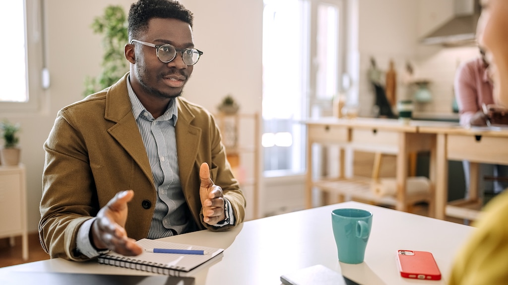 Man on a job interview in small home office