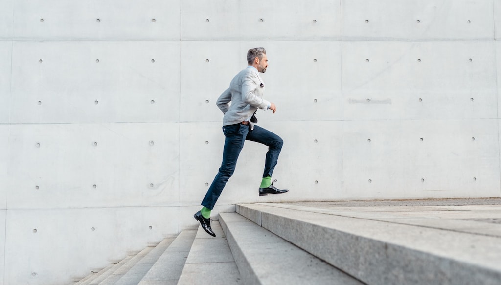 Man running up concrete stairs